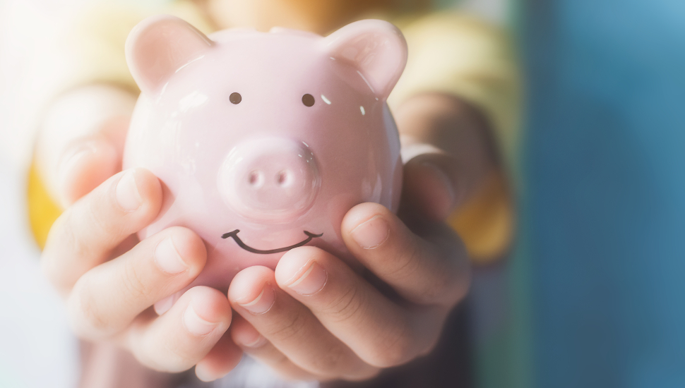 Girl holding piggy bank