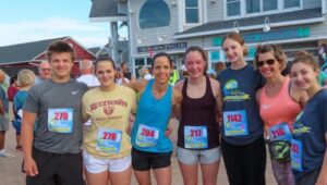 Participants in the Justin’s Beach House 5K Run/Walk gather after the race on Saturday, May 31.
