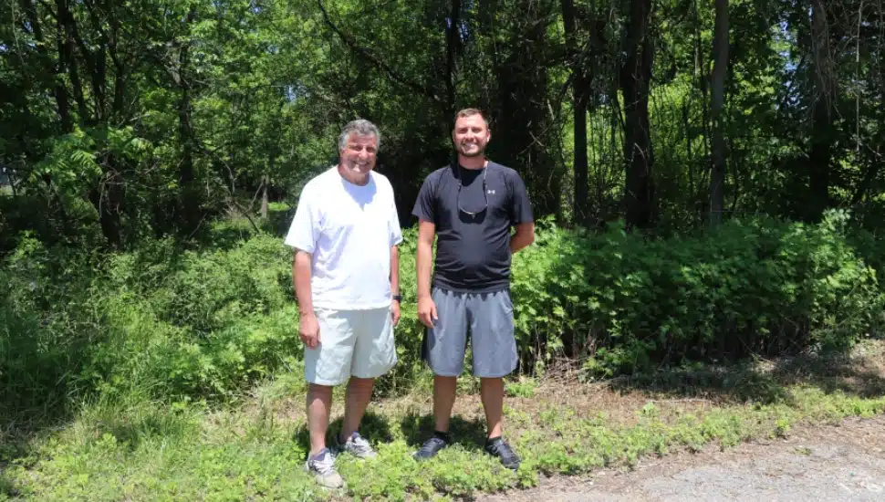 men standing in front of forest