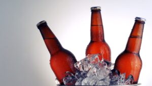 An ice bucket holding 3 bottles of beer.