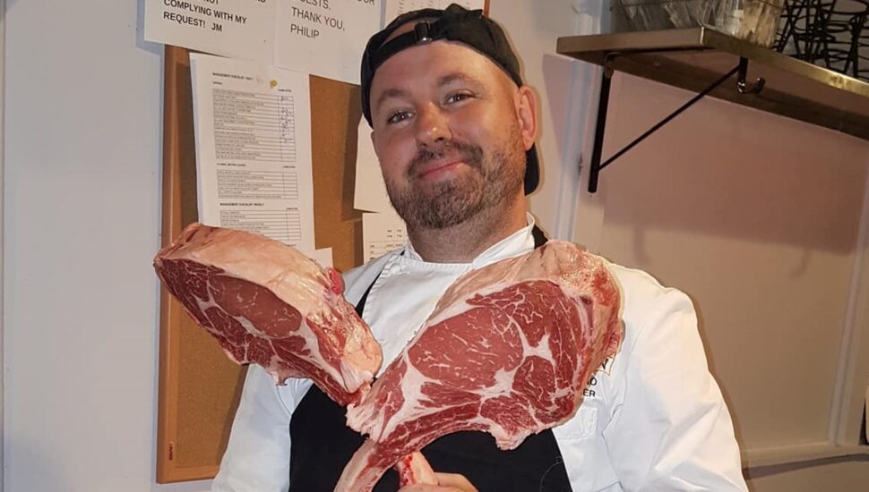 chef with ribeyes