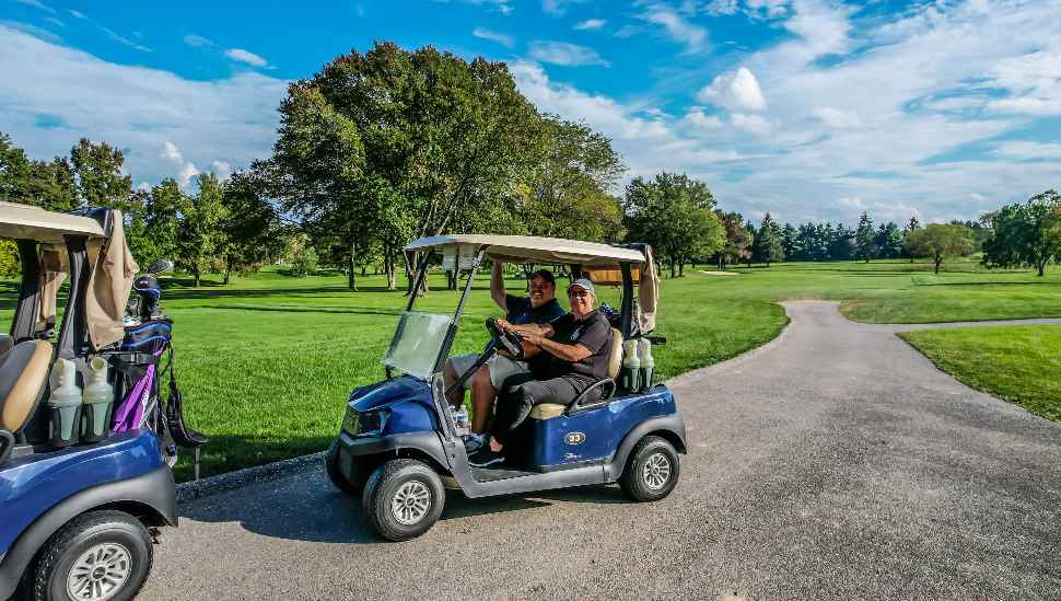 golfers in carts
