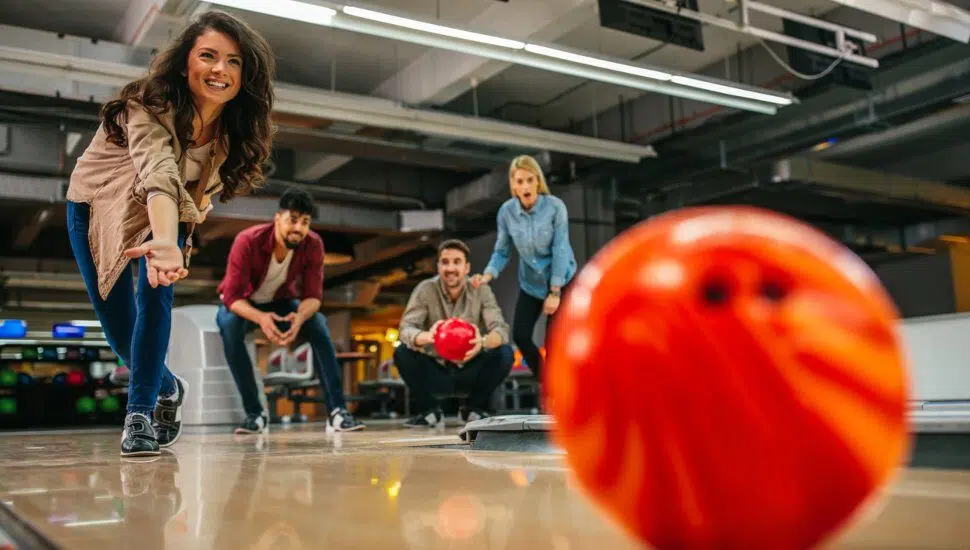 woman and friends bowling
