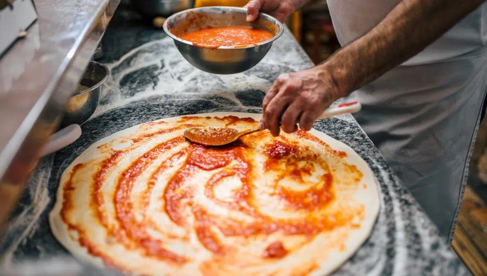 chef making pizza