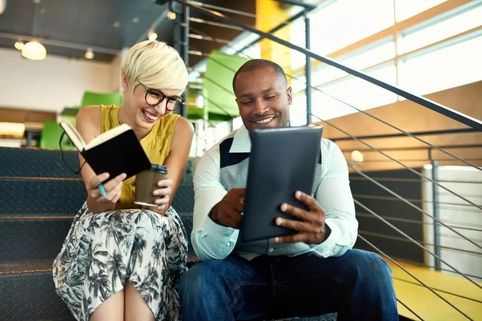 Man and woman enjoy an informal conversation at work