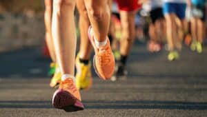 runners running marathon on pavement