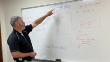 engineer teaching at whiteboard