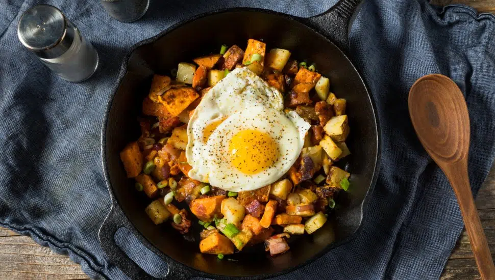 cooked egg on potatoes breakfast