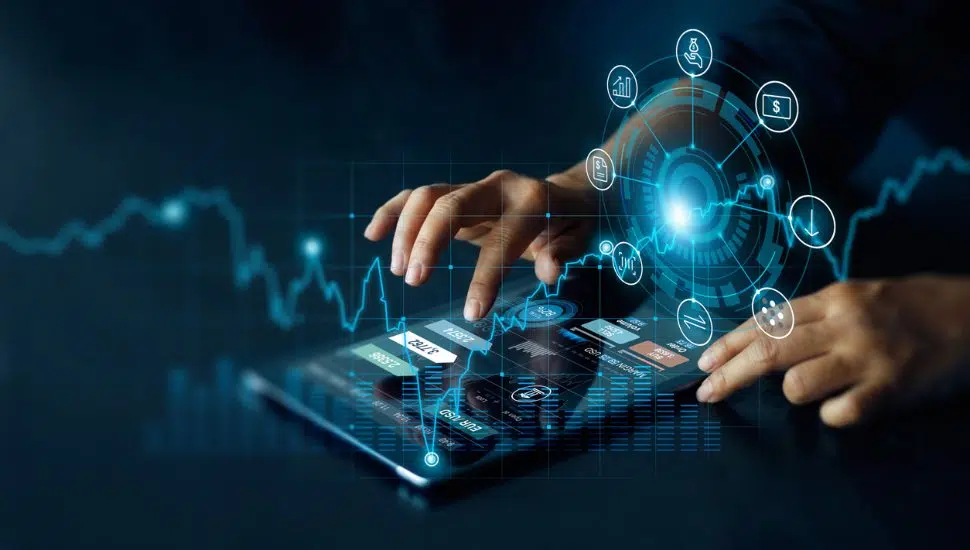 person using tablet, graphics representing technology