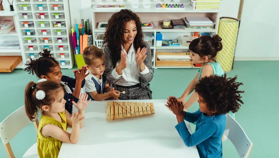 woman with kids at a table