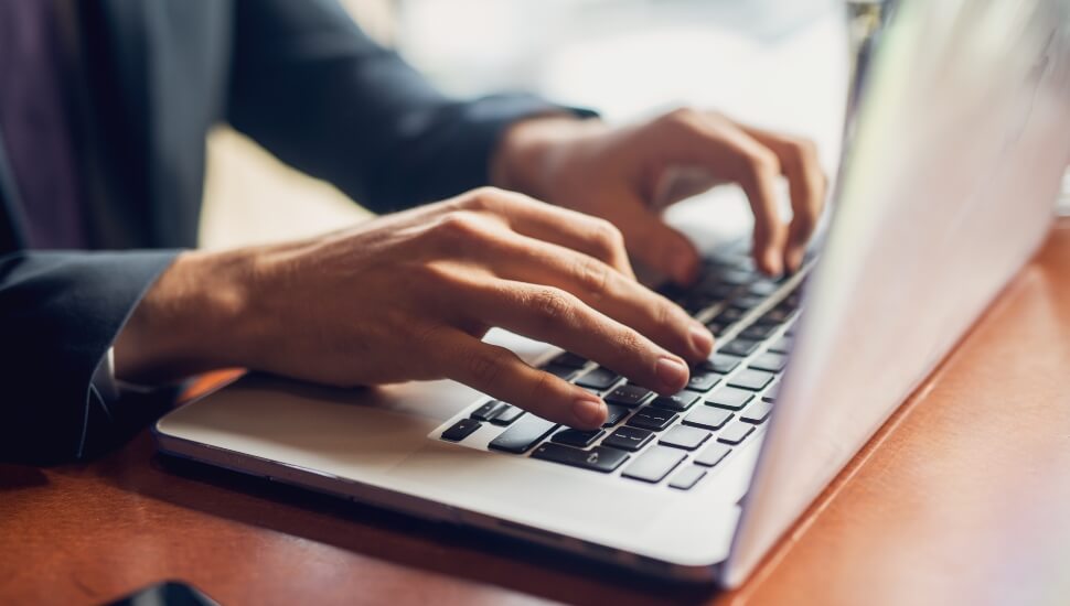 Man writing a cover letter