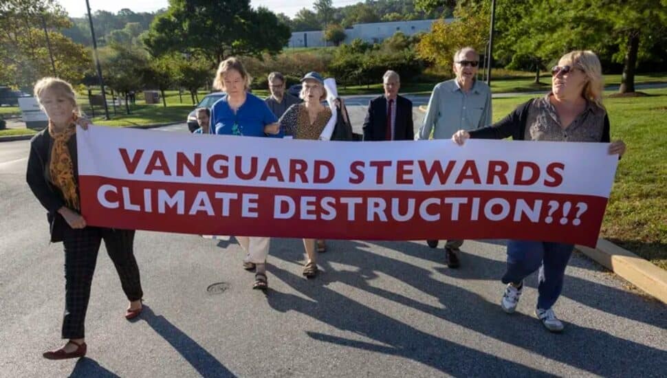 Quakers with Sign Protesting Vanguard
