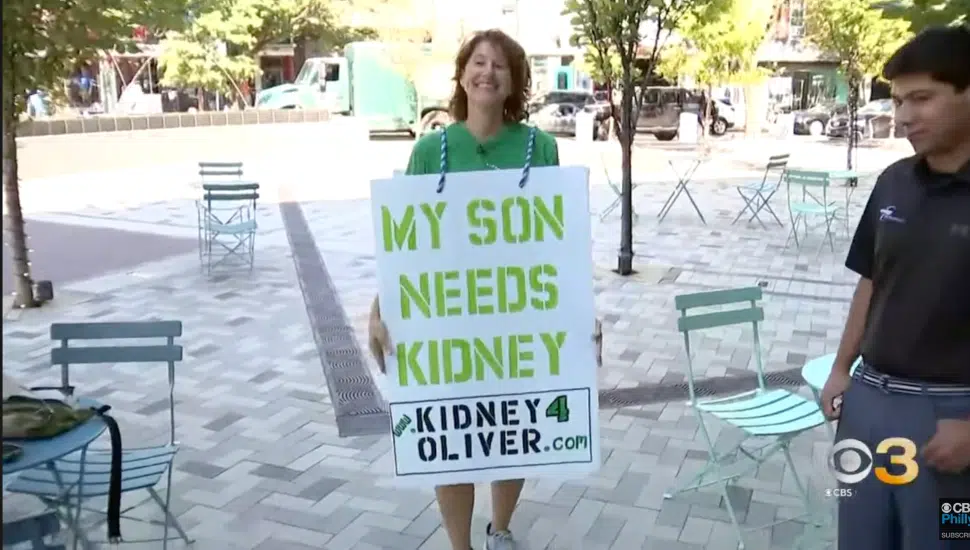 Tammy Mayer holding a sign