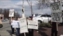 photo of protesters outside of bishop tube contamination site