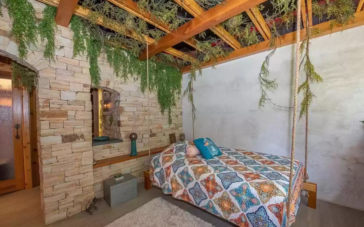 jungle-style bedroom with vines and stone