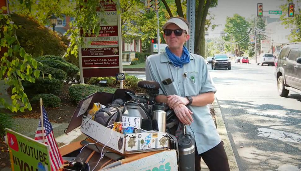 man leaning on cart