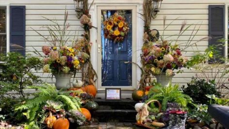A front entryway of a home decorated for Fall