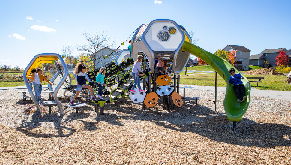 Kids playing on Hedra playground equiment