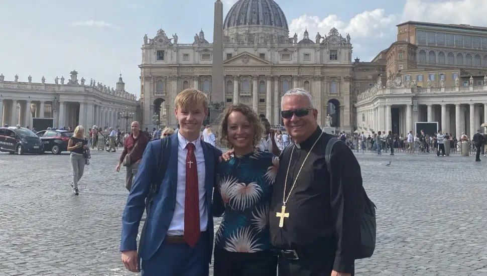 Sam Gorman with Marisally Santiago and Archbishop Nelson Pérez