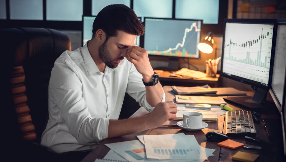 Young man tired at work