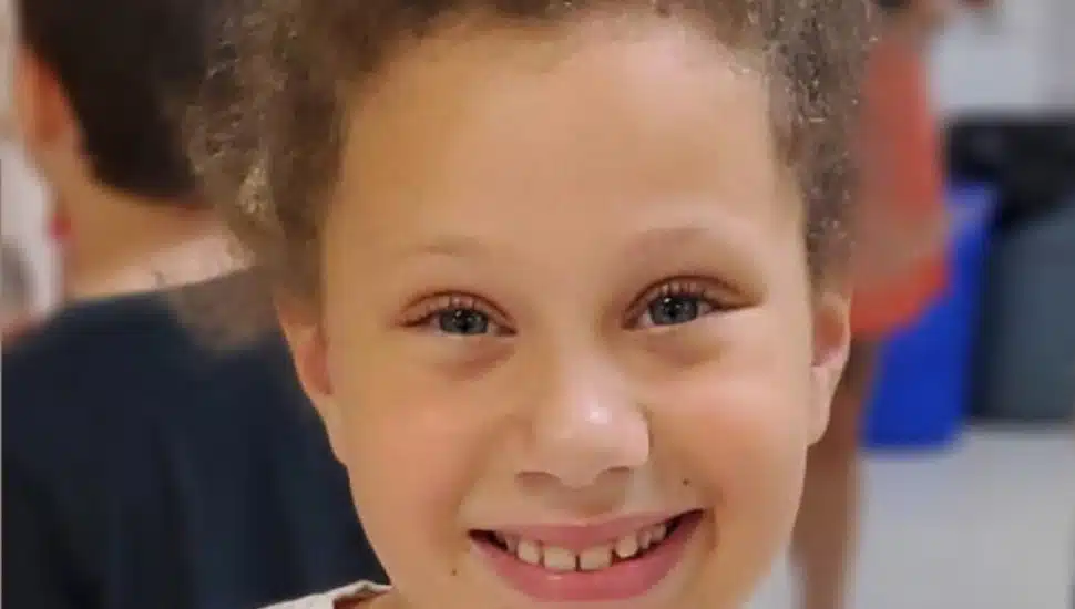 A child smiles during the Friends Association 'Fund for Friends' campaign