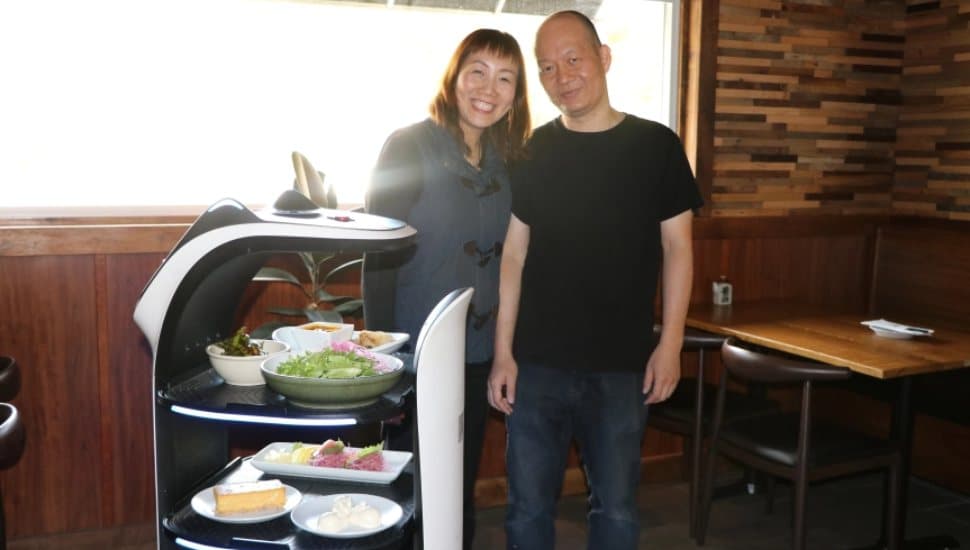GuGu Asian Table owners with Bella the robot