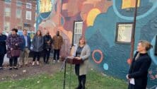 Jennifer Lopez, CEO of the Friends Association, speaks at a wall mural dedication in West Chester