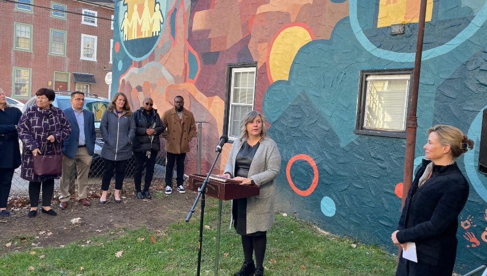 Jennifer Lopez, CEO of the Friends Association, speaks at a wall mural dedication in West Chester