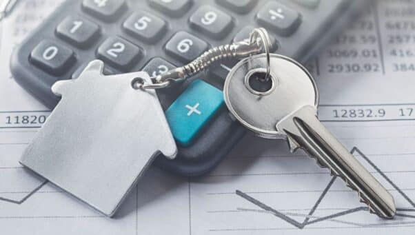 Real estate, keychain with house symbol. Key with finance blank.