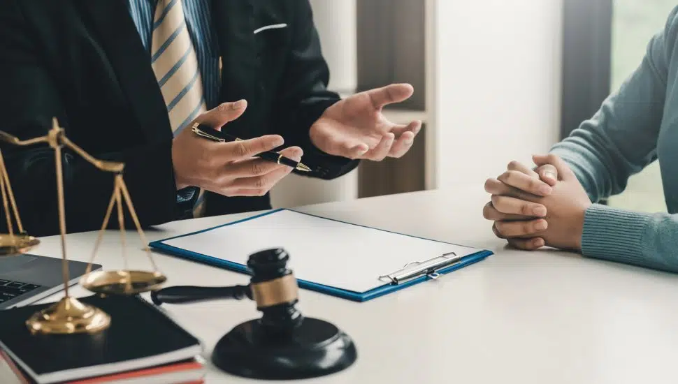 lawyer in office with customer