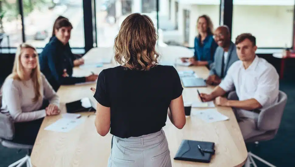 businesswoman addressing a meeting in office.