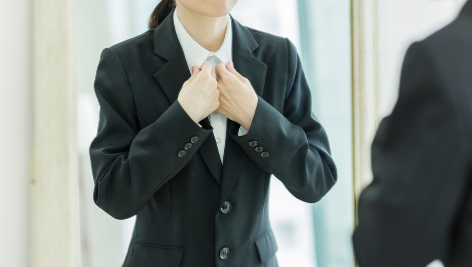 woman trying on suit