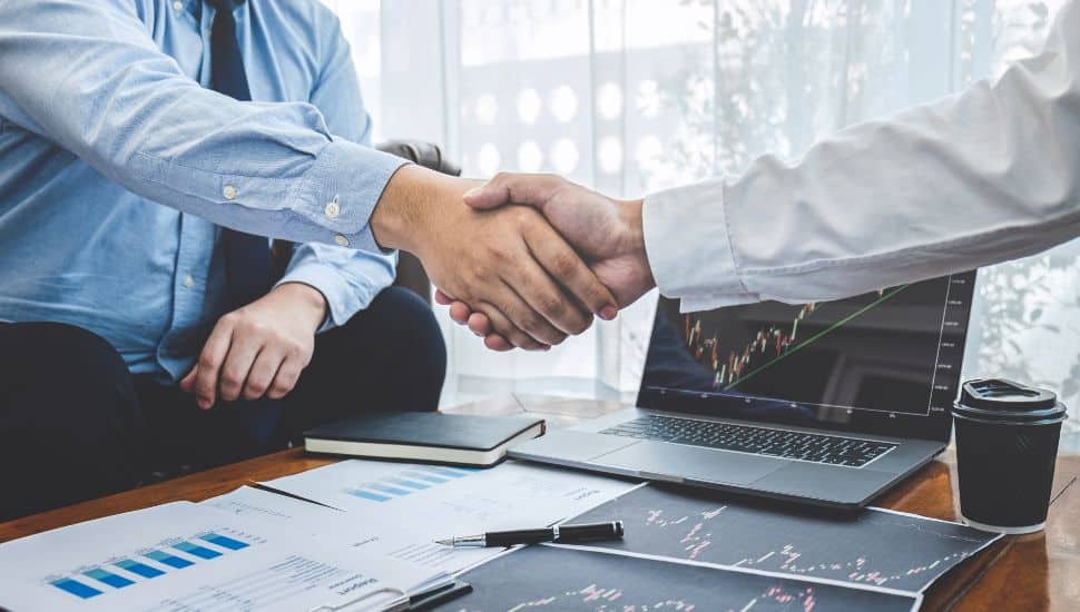 Businessman shaking hands after conversation, Finishing up a collaboration discussing of partner cooperation in investment marketing project and successful contract agreement to become teamwork.