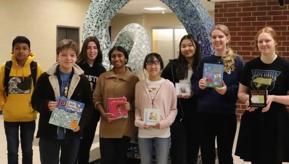 Rustin High Schoolers with books