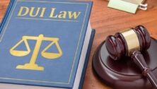 A book on DUI law with a gavel symbolizes the enforcement of Deana's Law in Pennsylvania