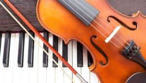 Violin and piano keyboard. Music background.