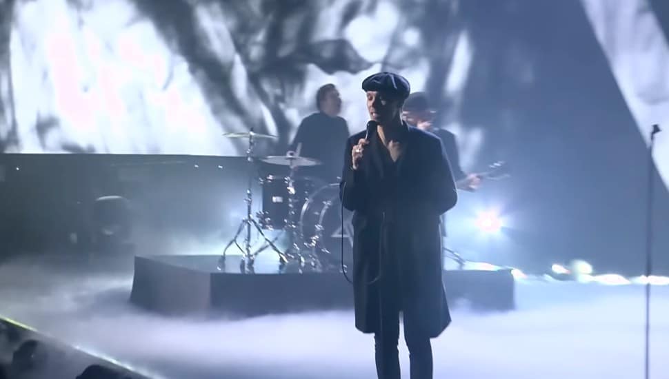 Ville Valo performing onstage.