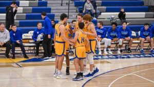 Widener men's basketball players on the court