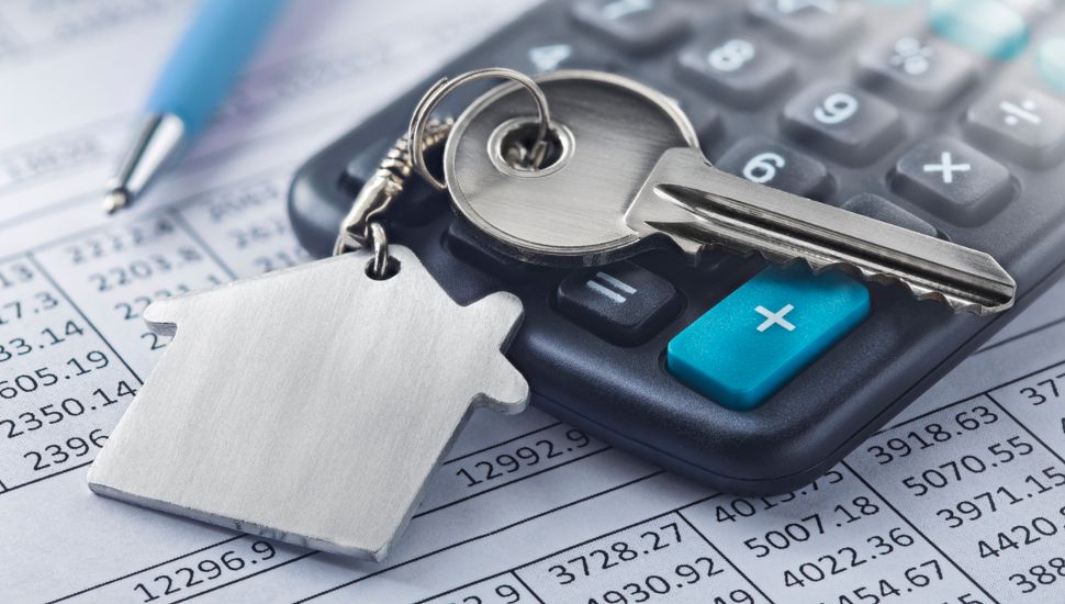 Real estate, keychain with house symbol. Key with finance blank.