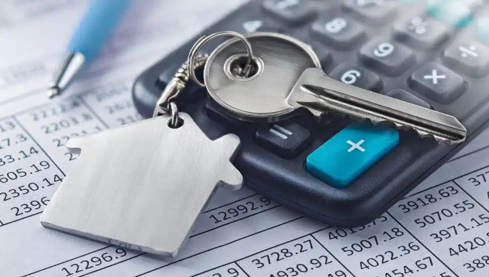 Real estate, keychain with house symbol. Key with finance blank.