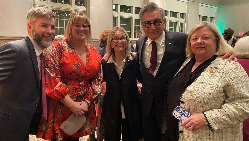 Conor Hepp, far left, with guests, along with actor Eugene Levy.