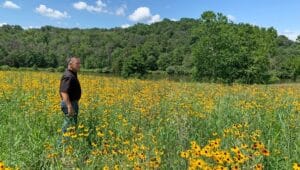 Chester County Parks and Trails Manager Owen Prusack seeding one of the areas that will become a native wildflower and warm season grass meadow at Hibernia County Park.