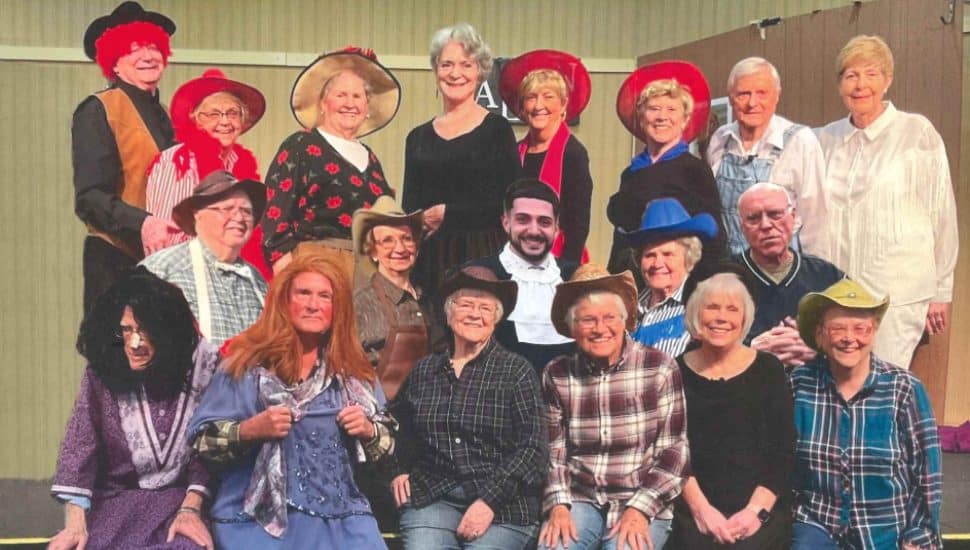 The Village Player performers in a production of Way Out West in a Dress.