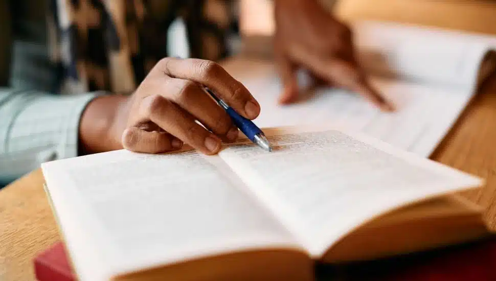 person researching and writing