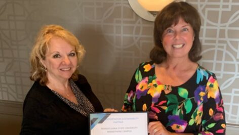 Penn State Brandywine Director of Finance and Business Margaret Buban, left, receives a certificate of recognition from Delaware County Transportation Management Association Executive Director Tracy Barusevicius.