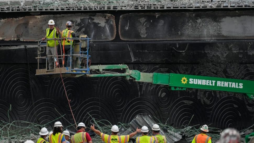 Work crews at the site of the I-95 overpass collapse.
