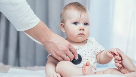 Baby being examined by a doctor