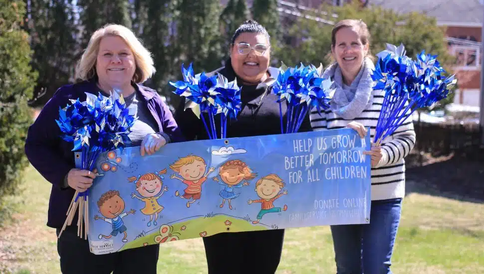 The ECFC team during the April 2023 Pinwheels for Prevention campaign to raise funds for child abuse awareness.