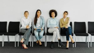 women sitting on chairs
