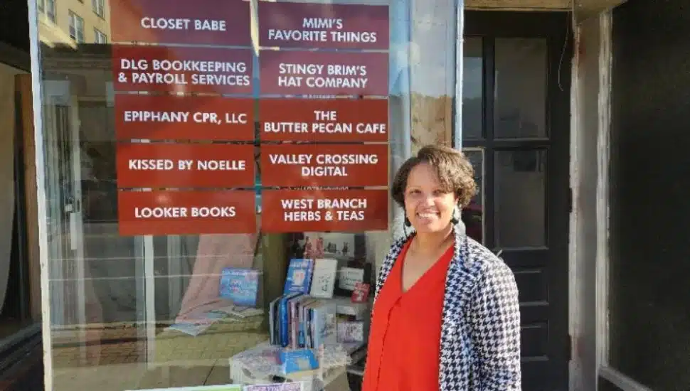 Jamoca Harkins in front of the Butter Pecan Cafe.